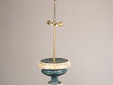 a sculpture of a bird on top of a pedestal