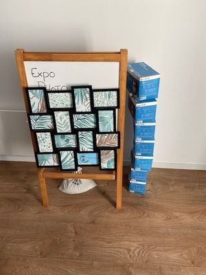 a wooden easer with a bunch of pictures on it
