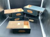 several boxes are stacked on top of each other in a metal container