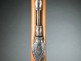 a close up of a wooden stick with a metal handle