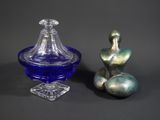 two glass vases sitting next to each other on a table
