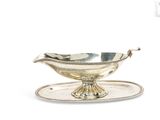 an antique silver plate with a bowl on it on a tray