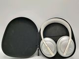 an image of a pair of white headphones in a black case