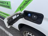 a white van with a green sign on the side of it