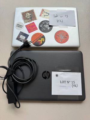 a laptop with a lot of stickers on it