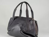 a black leather handbag with a zipper on the front