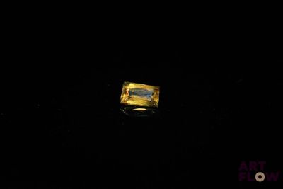 a ring that is sitting on a table in the dark