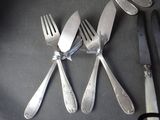 four forks and a knife on the table
