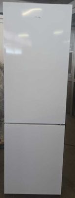 a white refrigerator that is sitting in a room