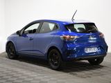 the rear end of a blue car parked in a room