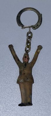 a keychain with a figure of a man on it
