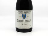a bottle of wine that is sitting on a table