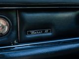 a close up of a car dashboard with a clock on it