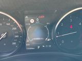 a close up of a car dashboard with various gauges