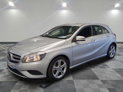 the mercedes b - class is parked on a checkered floor