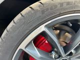a close up of a tire on a car ' s rim