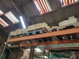 a large amount of boxes stacked on a rack in a warehouse