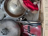 a box full of old silver pans and pans