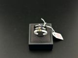 a close up of a ring in a box on a table
