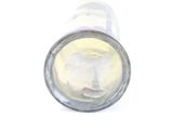 a close up of a glass bottle with a liquid inside of it