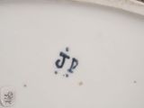a close up of a plate with a number on it