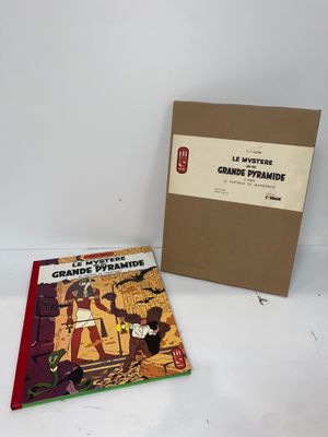 an image of a book and a box on a white surface