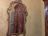 a mirror on the wall in the corner of a room
