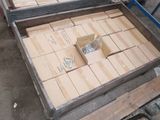 two boxes of wood sitting on top of a pallet