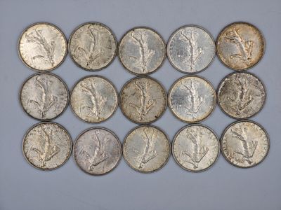 a close up of a bunch of coins sitting on top of a table