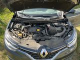 a car with its hood open and the engine in the trunk