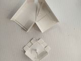 two pieces of paper that are sitting on a table