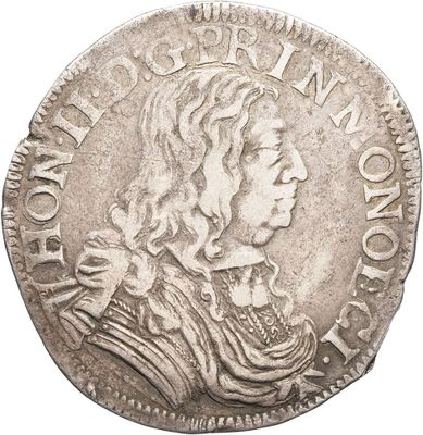 a silver coin with an image of a man on it