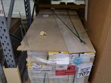 a stack of boxes on a pallet in a warehouse