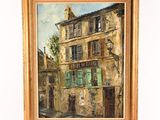 une peinture à l'huile représentant un bâtiment, encadrée dans un cadre en bois et accrochée au mur