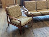 two chairs and a couch in a living room