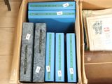 a box full of books that are sitting on the floor