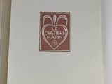 an open book with a picture of a heart on the cover