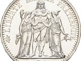gros plan d'une pièce de monnaie sur fond blanc