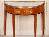 a small table with a mirror on top of it