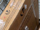 boxes are stacked on top of each other in front of a shopping cart