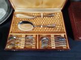 a box with silverware in it on a table