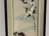 a picture of two birds flying in the sky