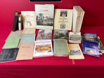 many books on a table with a red table cloth