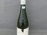 a bottle of wine that is sitting on a table