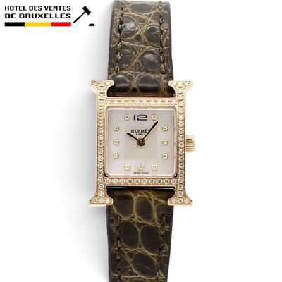 a close up of a wrist watch with diamonds on the face