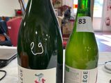 two bottles of wine that are sitting on a table