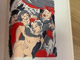 un livre ouvert sur lequel figure le dessin d'un groupe de personnes