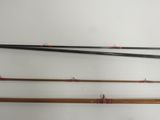 three different types of fishing rods are lined up against a white wall