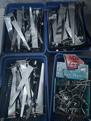 four trays of knives and a book sitting on a table
