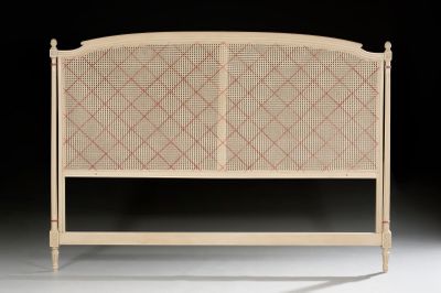a bed with a headboard made of wood and wicker